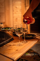grill in the room, petioles, holiday resort, wine, frying pan, fire under food

