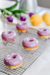 Obraz na płótnie Canvas Colorful dessert purple donuts Spring Easter