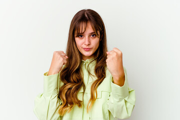 Young caucasian cute woman isolated on white background showing fist to camera, aggressive facial expression.