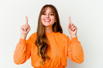 Young caucasian cute woman isolated on white background indicates with both fore fingers up showing...