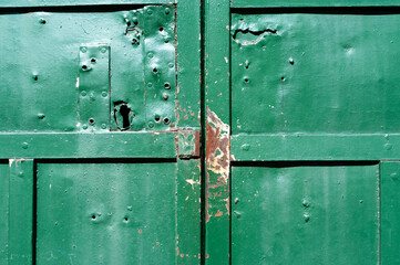 Broken green door