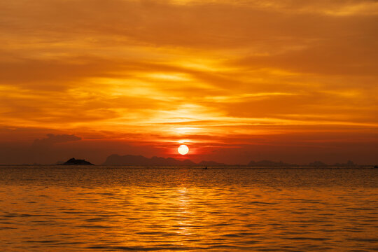 Beautiful sunset over the sea water on the island of Koh Phangan, Thailand