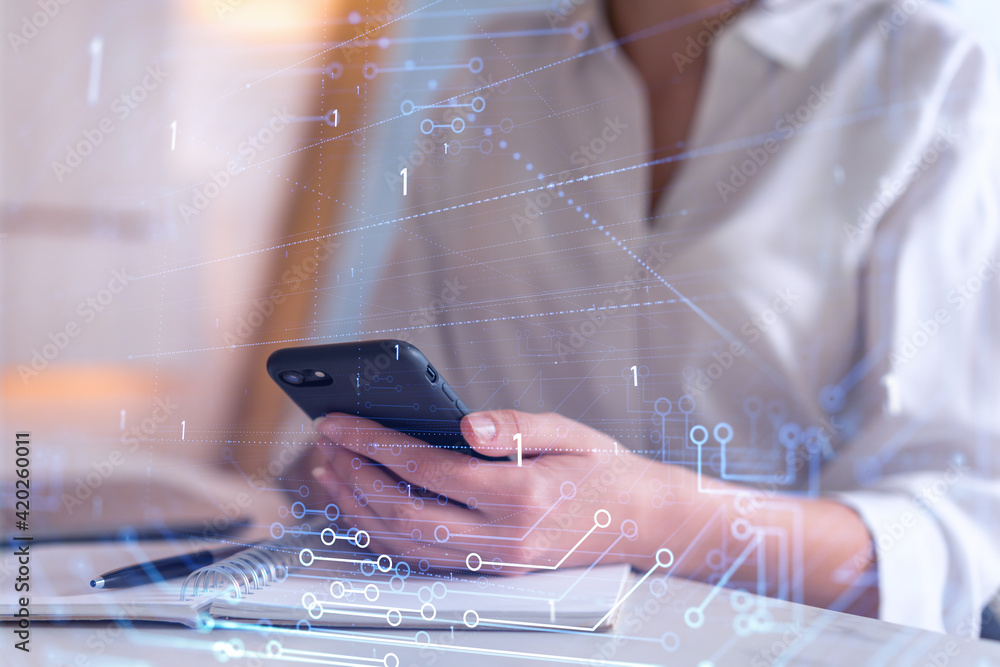 Poster businesswoman in formal wear holding in the hands a smart phone and testing an innovative applicatio