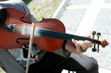 The violin, while playing the violin 