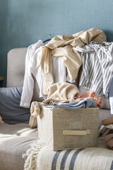 Spring cleaning,Fast fashion, the girl puts things in order in the closet. A bunch of colorful...