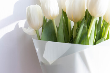 a bunch of white natural tulips