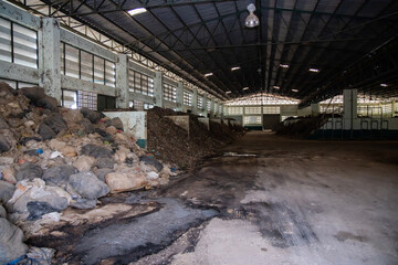 Garbage pile with solid waste in waste disposal plant for make composed fertilizer to argriculture industrial.