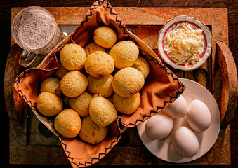 cheese bread in the basket and composition flour, grated cheese and eggs