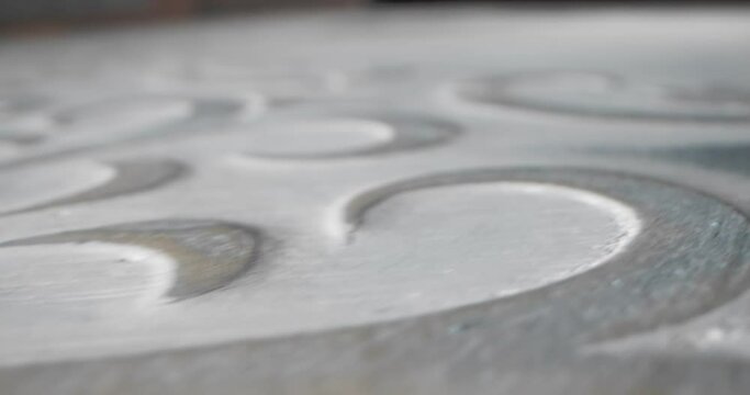 detailed extreme close-up surface of decorative plaster floral white turquoise print.