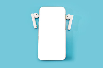 smartphone with blank white screen and headphones on a blue background.