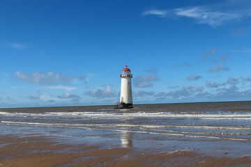Talacre lighthouse on a late summer's afternoon with the tide coming in