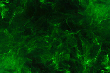 Fototapeta na wymiar Green steam on a black background.