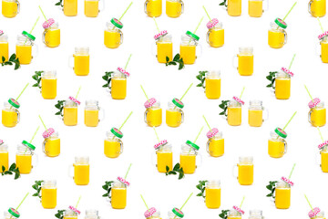 Seamless Pattern Orange juice and green leaves isolated on a white background.A glass of orange juice. Healthy food. Vegan food
