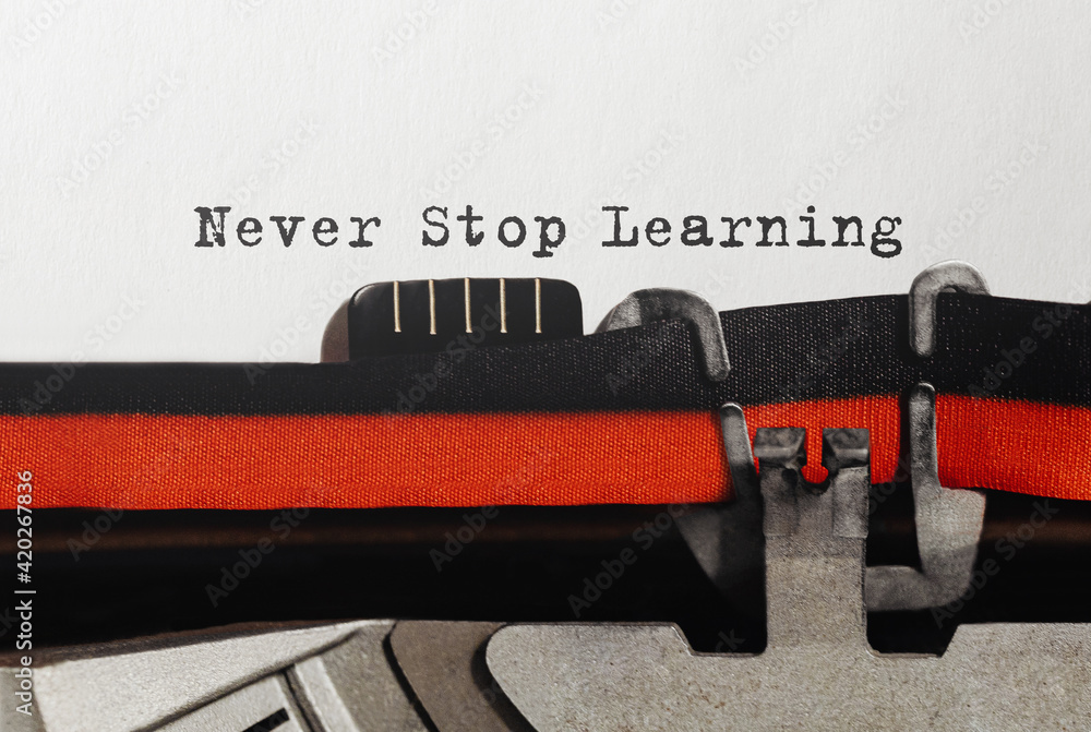Poster text never stop learning typed on retro typewriter