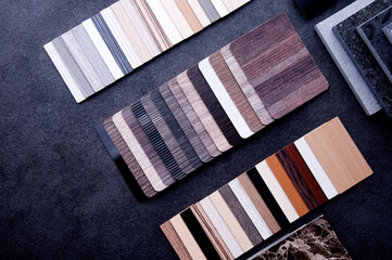 Materials design for home decoration and renovation. Top view of wood laminate materials on wooden floor.