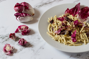 Trofie with radicchio. Autumn dish vegetarian version..