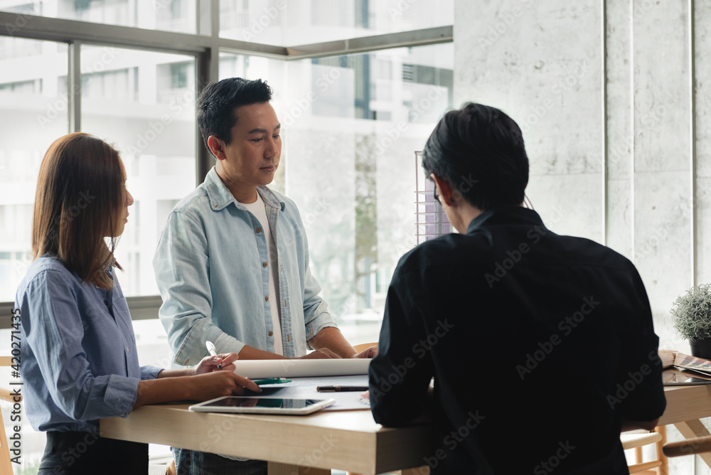 Poster heads of each department meeting together between construction engineers with architect and sales. b