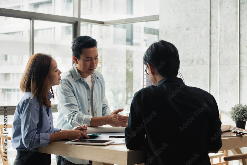 Poster heads of each department meeting together between construction engineers with architect and sales. b