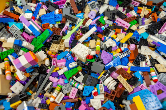 Lots of colorful Lego pieces. Lego background. Selective focus. Minsk, Belarus - March 2021