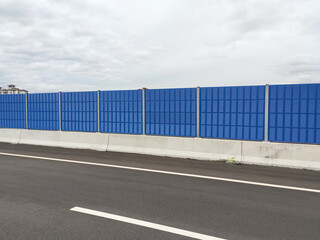 Noise barriers are installed along the vehicle lane bordering the residence to prevent noise pollution to the locals.
