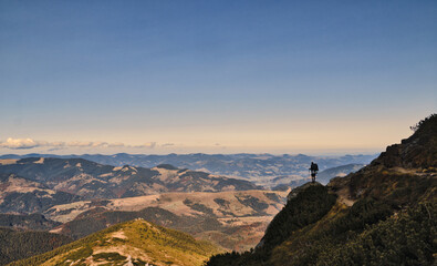 silhouette of a person on a rock
