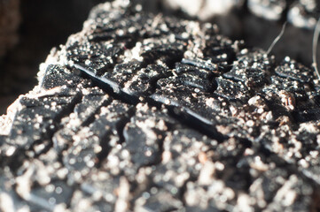 Winter rubber tread in the sand close up, macro photography