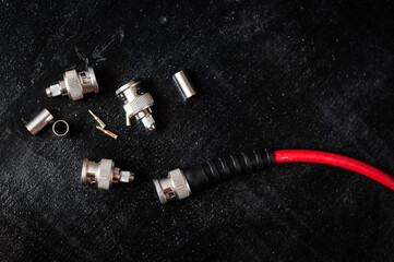 bnc connector for transmitting video and audio signal in filmmaking on a dark background