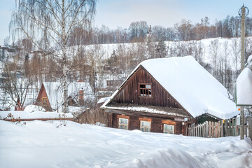 Abandoned old wooden black house in Plyos. Caption: Blacksmith Lane