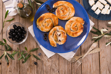Pastry swirls with cheese and olive filling.