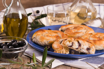 Pastry swirls with cheese and olive filling.