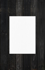 Blank White A4 paper sheet mockup template on black wood background