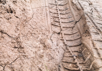 textured car track in the mud. dry land website template