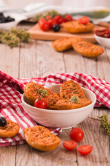 Toasted bread with tomato and oregano. 
