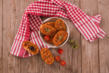 Toasted bread with tomato and oregano. 