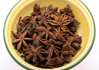 Star anise in a vintage ceramic bowl