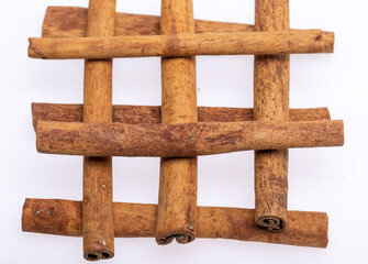 Cinnamon sticks, classic spice from the inner bark of tropical Asian trees, flavorful and aromatic for cooking, baking, health food and medicinal uses.