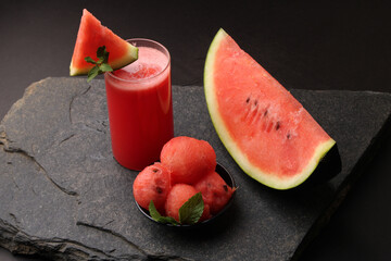 Watermelon smoothies or juice topping with fresh watermelon and mint leaves for summer drinks concept.