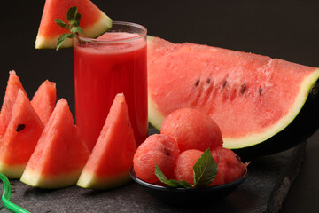Watermelon smoothies or juice topping with fresh watermelon and mint leaves for summer drinks concept.