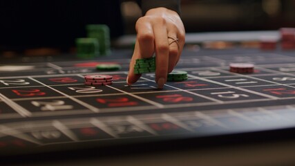 player placing bets at casino