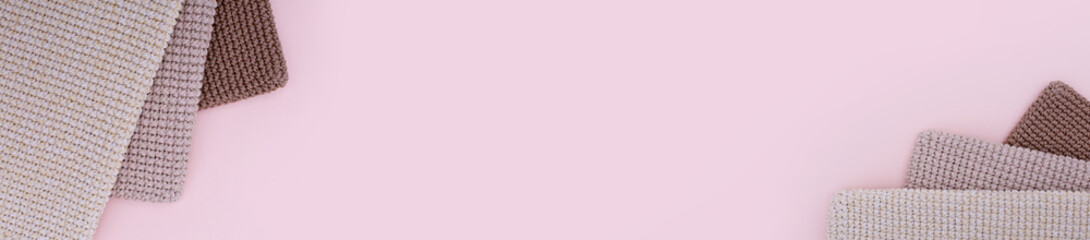 Banner with brown knitted handmade bags or other homemade things on pink background. Eco-friendly shopping. Zero waste lifestyle. Top view, copy space