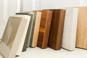 Samples of laminate and vinyl floor tiles for new construction or renovation of a building or home.