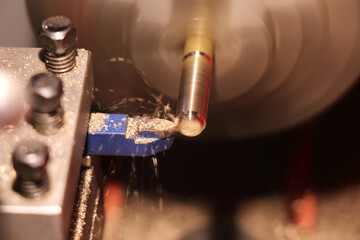 Close-up on turning of a brass bar