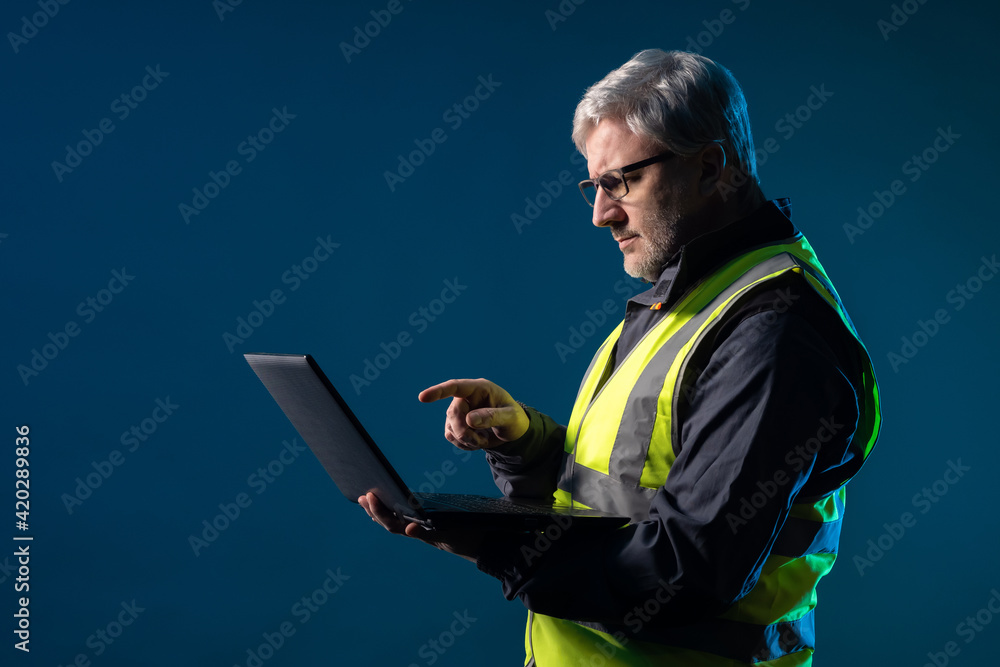 Poster builder contractor engineer is working on computer laptop. architect man with a party computer. matu