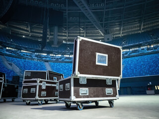 Concert equipment boxes. Stage equipment in transport boxes. Black wardrobe trunks on wheels....