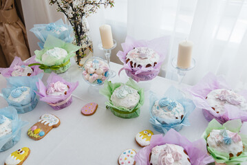 Beautiful Easter cakes on a decorated light table. A light holiday of Easter.