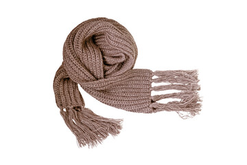 Knitted beige scarf with fringe isolated on a white background. Warm winter scarf of chunky knit, accessory in the cold season