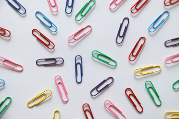 Colorful paper clips on white background