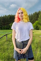 Portrait of teenage girl hipster 15, 16 years old with dyed hair