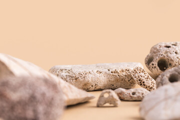 Background for products cosmetics, food or jewellery. Stone pieces podium. Front view.	