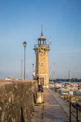 A lighthouse in a bay in Desenzano on the Italian Lake Garda. Desenzano, Lombardy, Italy